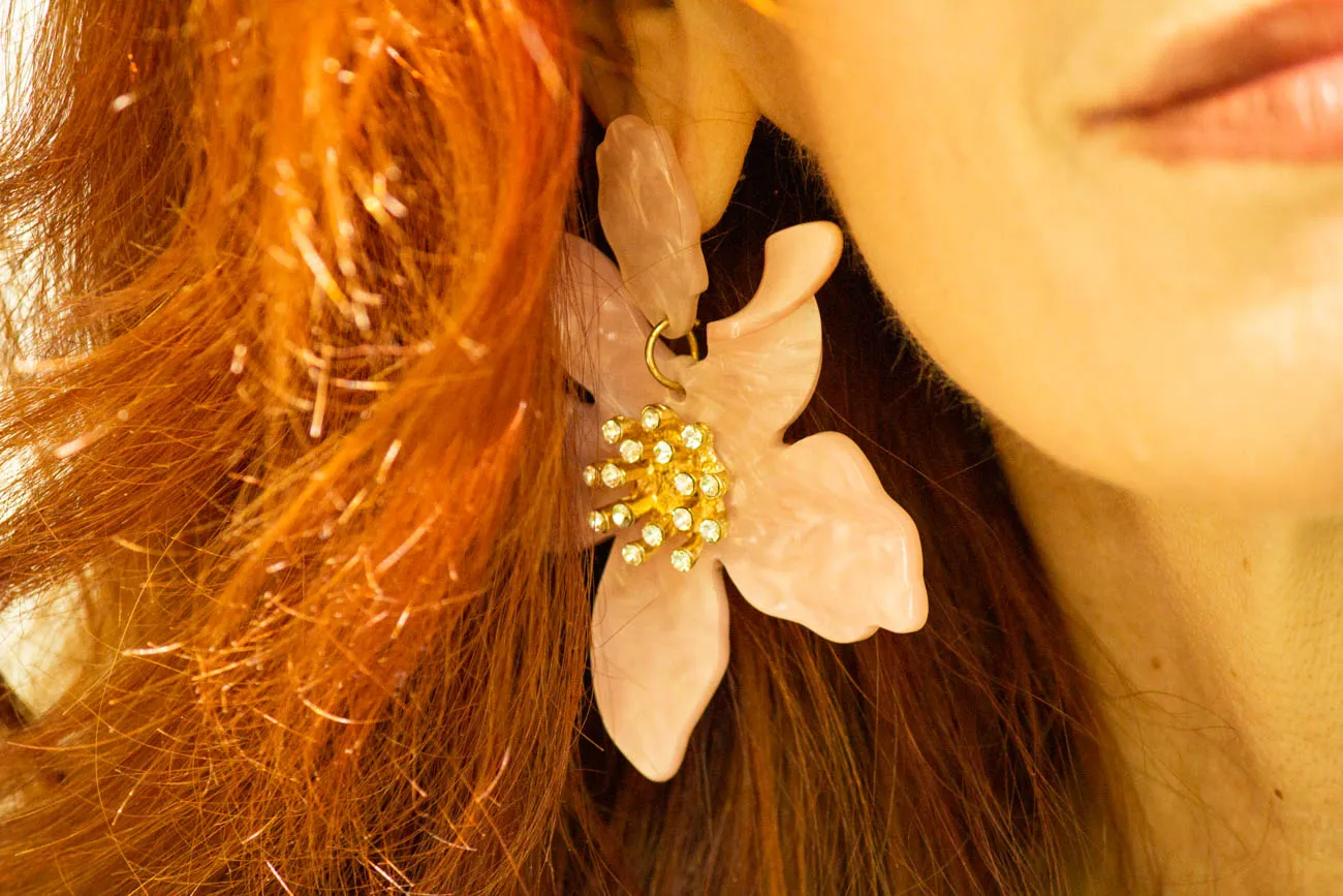 Statement floral earring close-up for summer outfit detail