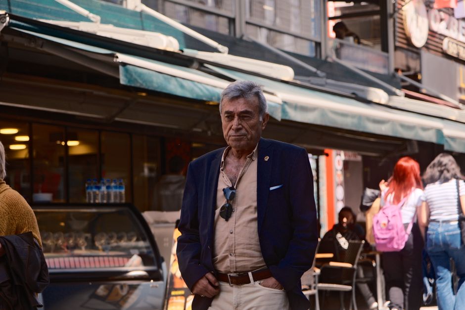 Elegant elderly man in the lively streets of Istanbul, Türkiye, exuding timeless fashion.