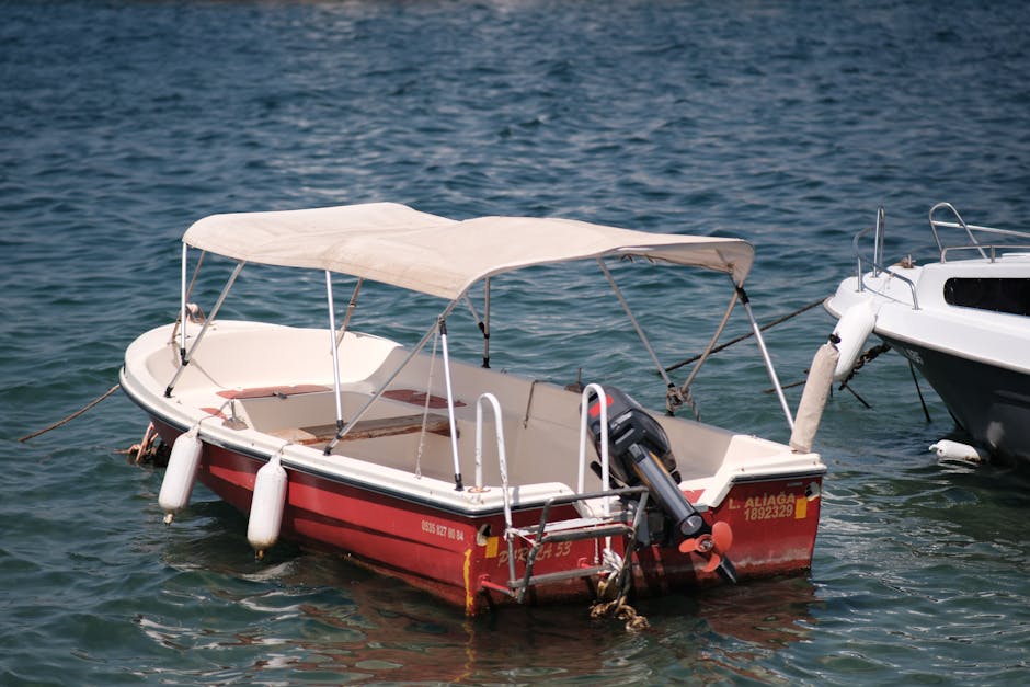 A small fishing boat with a canopy moored on the beautiful waters of Foça, İzmir.